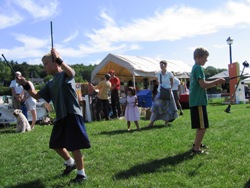 Kids at play with juggling sticks